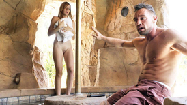 Muscular dude relaxes in hot water with a teen